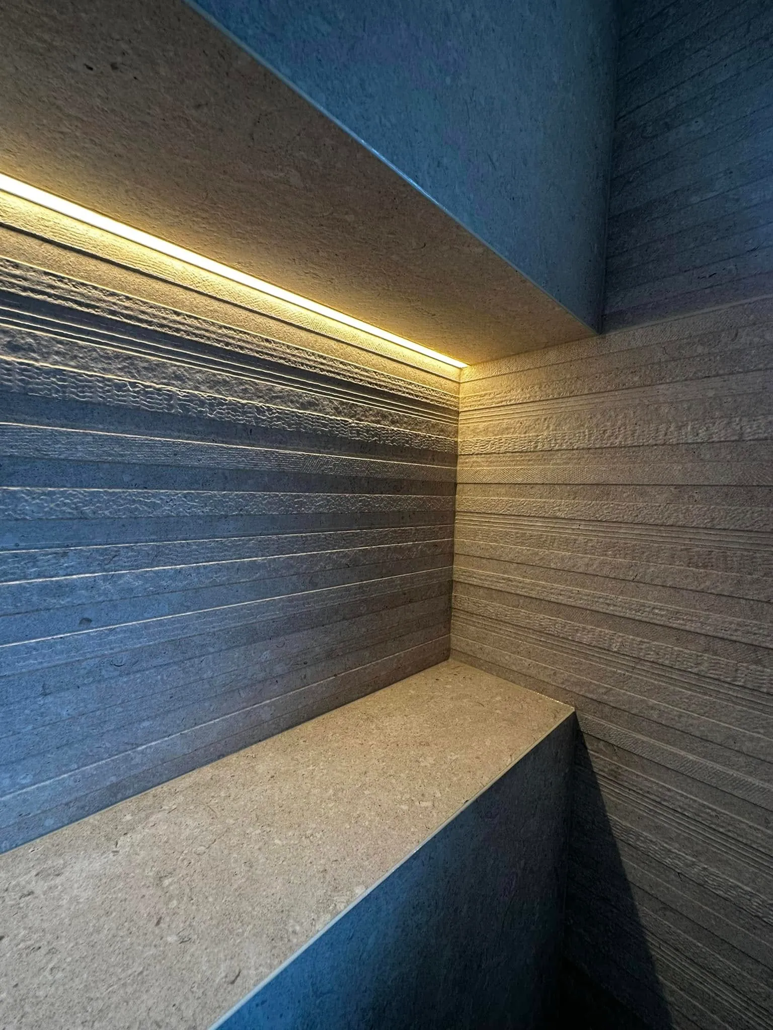 LED-lit fluted stone niche detail