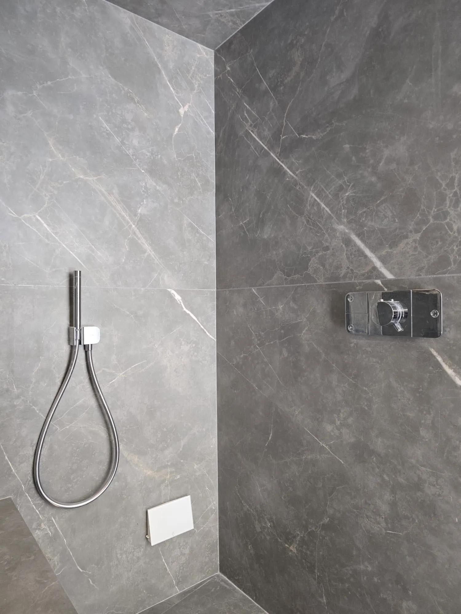 Chrome handset and thermostatic control detail